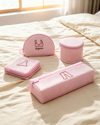 Pink mesh lingerie wash bags arranged on cream linen bedding